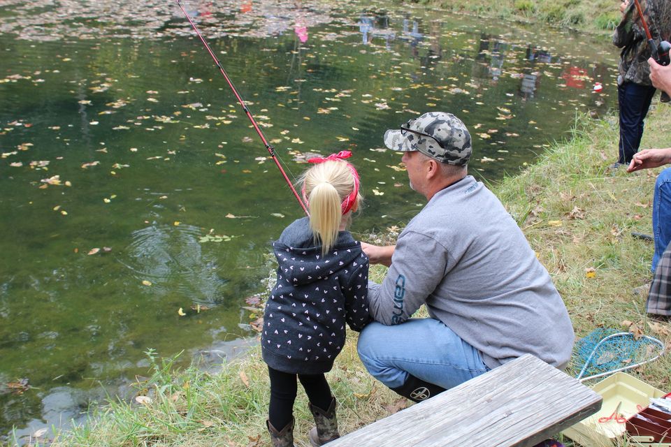 Young girl and father fishing at the Tony Huddleston Trout Rodeo